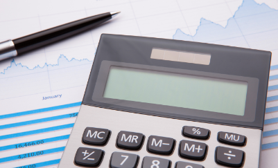 Pen and calculator on a report